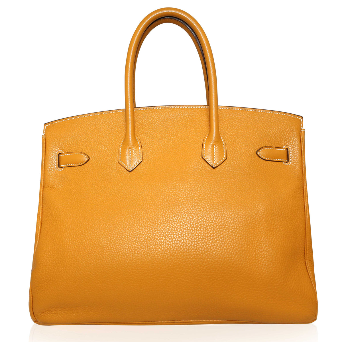 Hermès Birkin 35 Moutarde top handle bag with gold hardware, showcasing smooth leather and elegant design.