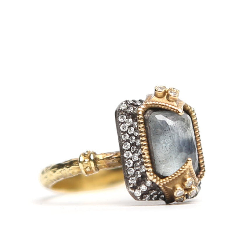 Side view of a grey rectangular stone and diamond ring by Other Designers, showcasing its elegant design and gemstone details.