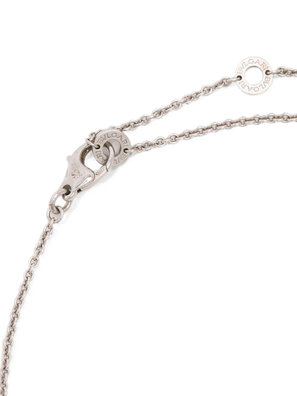 Bulgari silver necklace with onyx pendant, close-up view showcasing elegant jewelry design and craftsmanship.