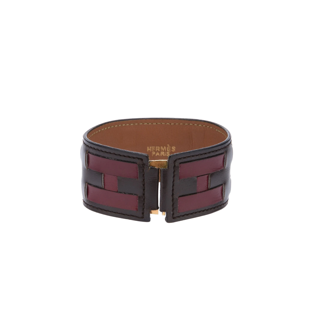Hermès vintage leather bracelet with braided design, stylish accessory showcasing smooth leather and elegant craftsmanship.