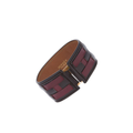 Hermès vintage leather bracelet with classic design, featuring smooth brown leather strap and subtle metal accents.