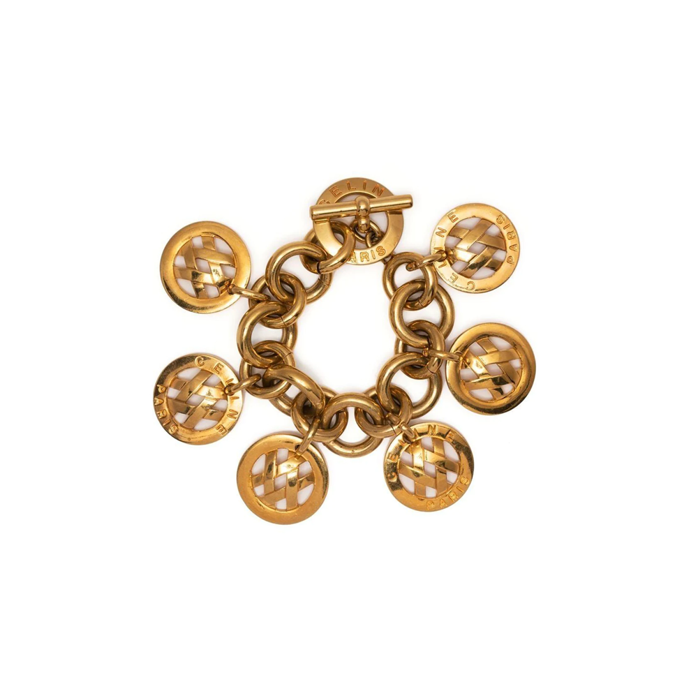 Celine curb chain charm bracelet with gold-toned links and decorative charms, stylish accessory for wrist.