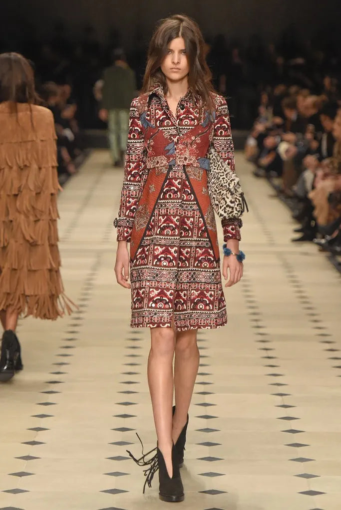 Burberry Fall 2015 embroidered trench coat featuring classic beige fabric with intricate embroidered details, stylish and timeless.