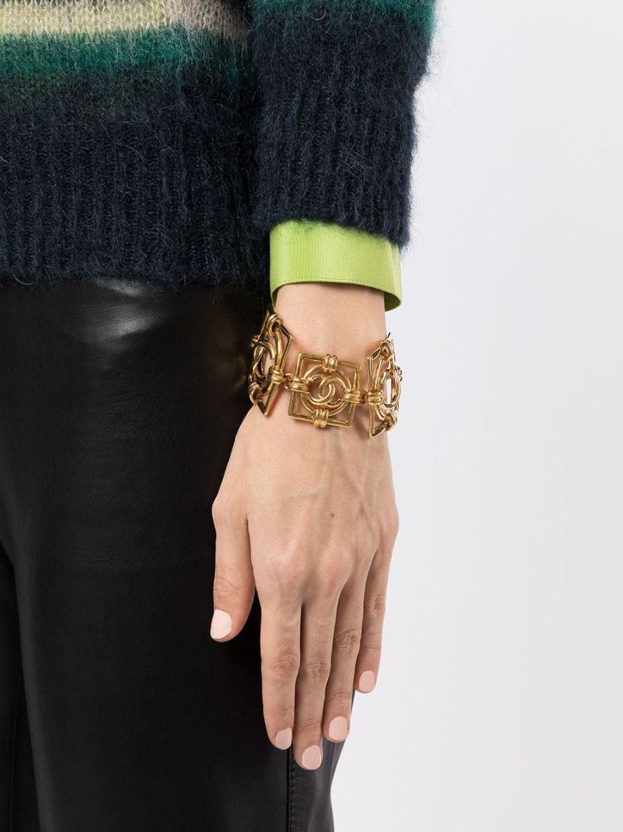 Gold Chanel Square Logo Bracelet featuring the iconic CC square motif, stylish jewelry accessory for elegant wear.