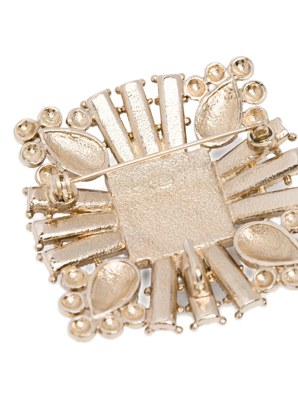 Chanel Crystals and Red Stones CC Brooch with sparkling crystals and vibrant red stones on a silver-tone metal setting.