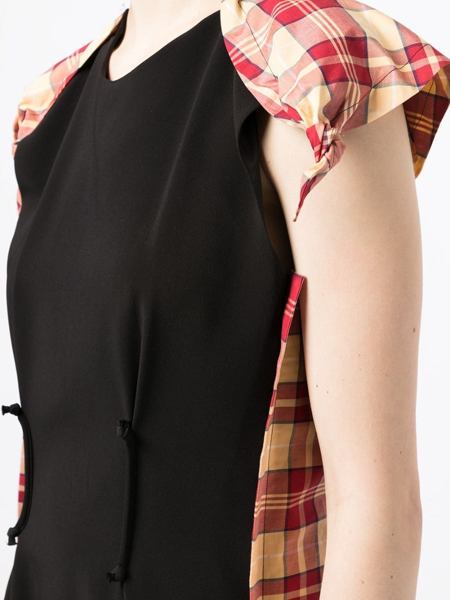 Celine checked panelled mini dress showing a stylish plaid pattern, short length, and fitted silhouette on a model.