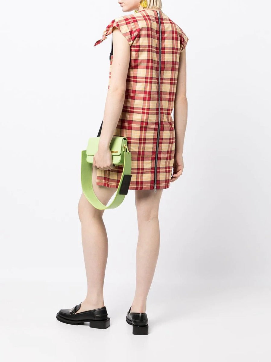 Celine checked panelled mini dress displayed on a hanger, featuring a stylish pattern and modern design perfect for fashionable outfits.