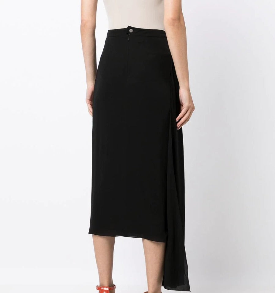 Chanel asymmetric silk midi skirt shown from the back, elegant design with flowing fabric and unique hem detail.