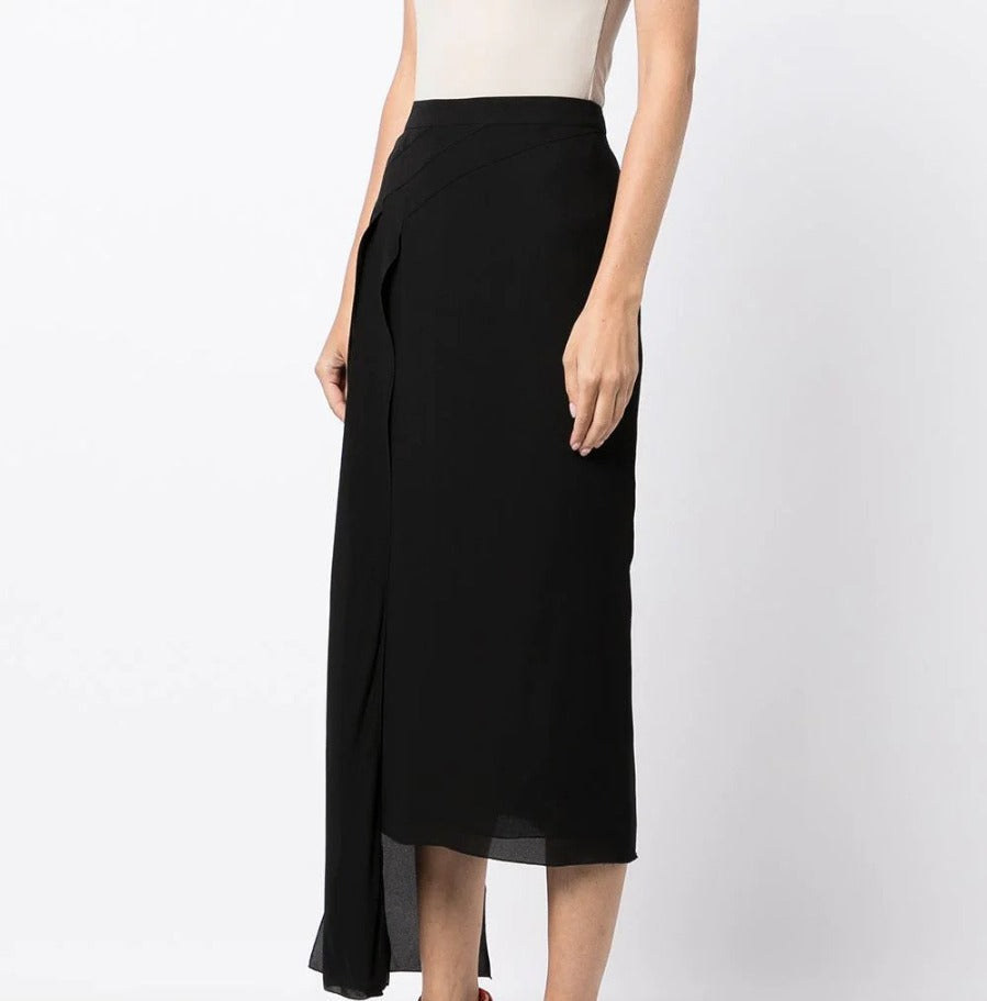 Chanel asymmetric silk midi skirt shown from side, featuring elegant draping and a flowing silhouette.