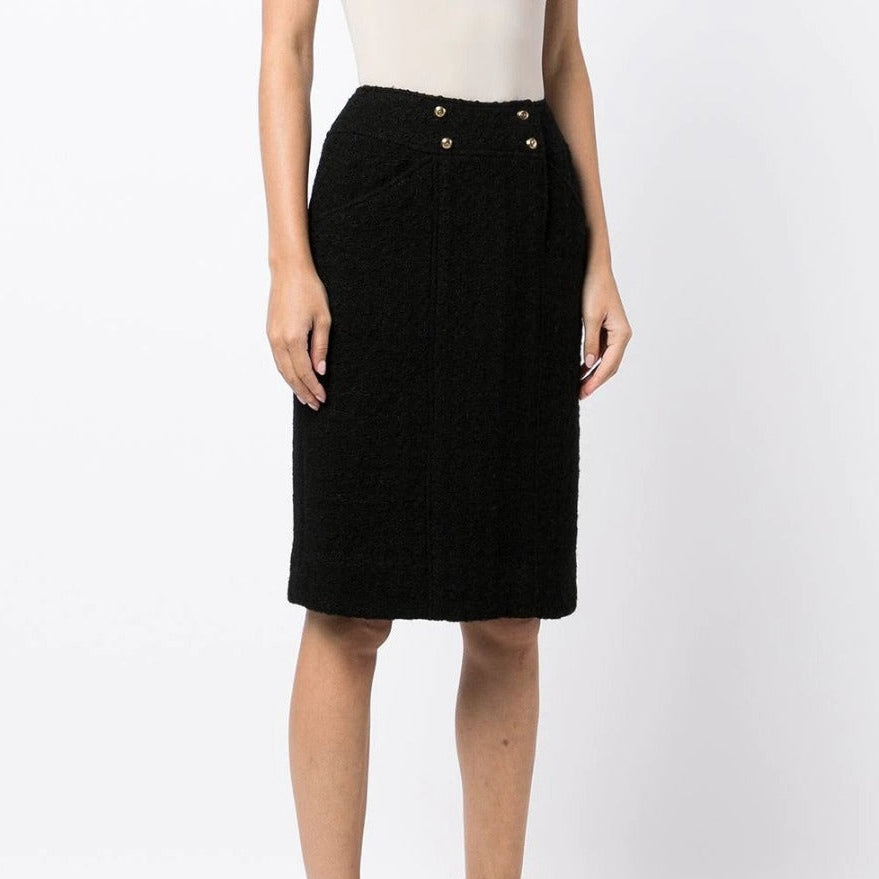 Chanel tweed pencil skirt with high waist and classic pattern, front view showcasing tailored fit and elegant design.