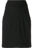 Black wool crisscross skirt from Chanel featuring a stylish, high-waisted design with a textured pattern.