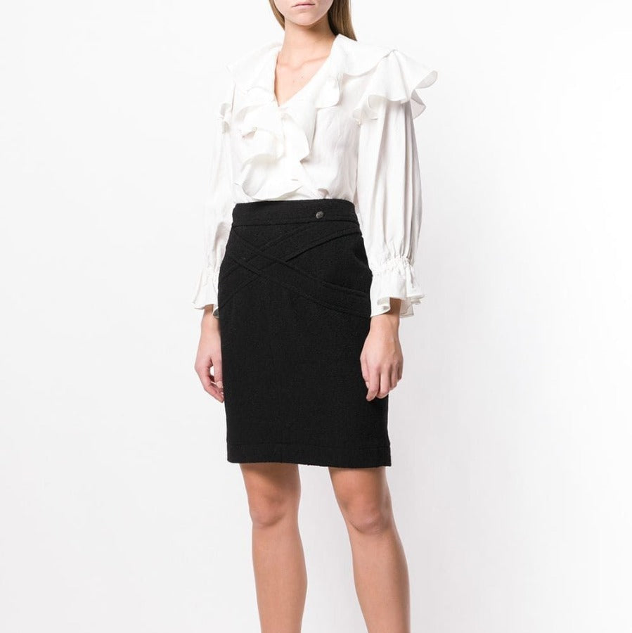 Black wool crisscross skirt from Chanel, stylish A-line design with overlapping details, perfect for elegant or casual outfits.