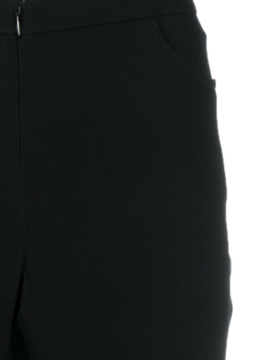 Chanel black silk trousers with a tailored fit, featuring a smooth fabric and classic design for elegant style.