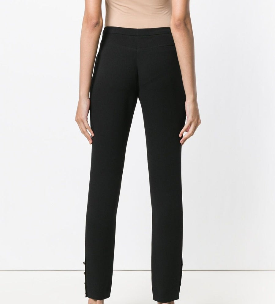 Black silk Chanel trousers with a tailored fit, featuring a sleek waistband and smooth fabric, perfect for elegant everyday wear.