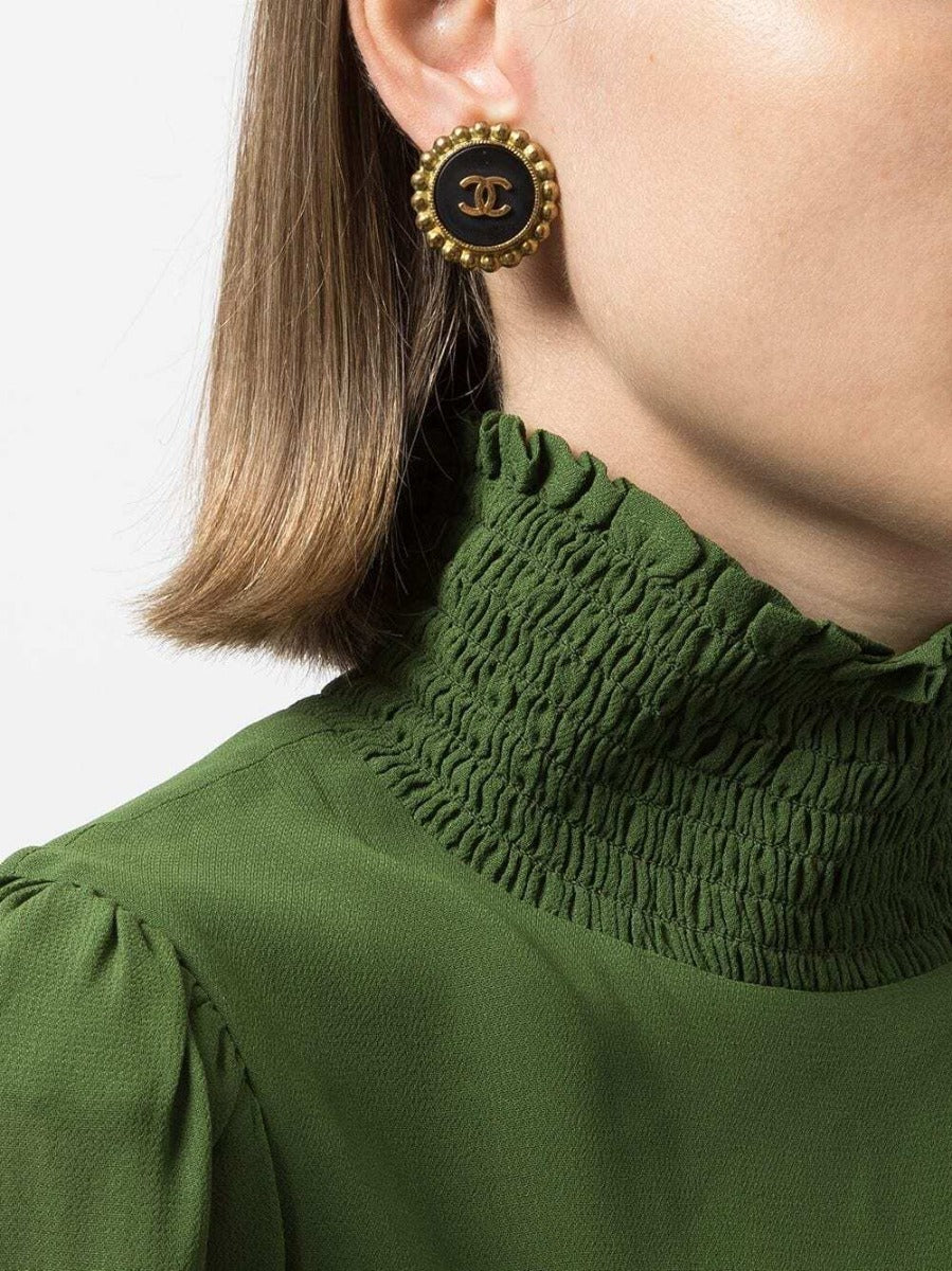 Chanel CC button clip-on earrings with gold-tone finish and classic logo design, suitable for non-pierced ears.