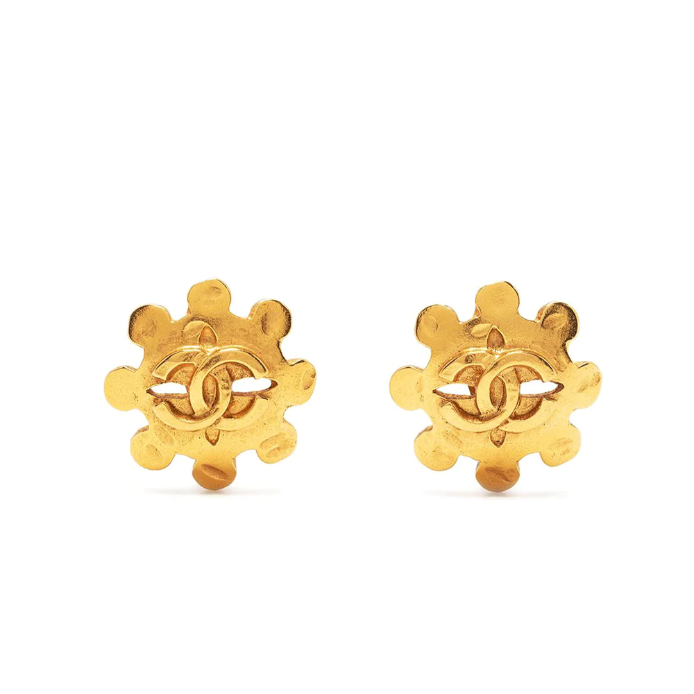 Chanel Cut Out Wheel Clip-On Earrings featuring circular design and silver finish, stylish accessory for elegant jewelry looks.