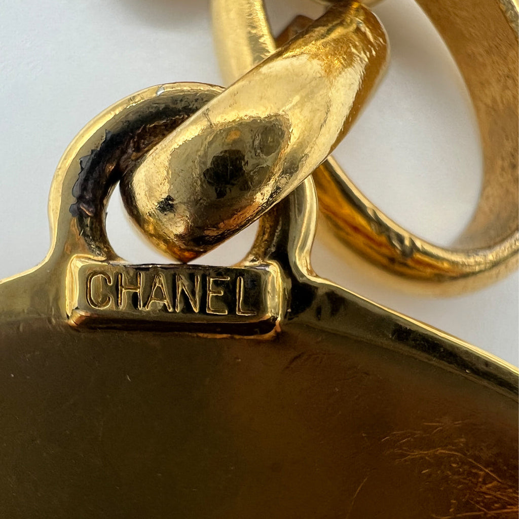 Chanel 1989 CC Medallion Necklace featuring the iconic logo pendant on a sleek chain, showcasing luxury jewelry design.