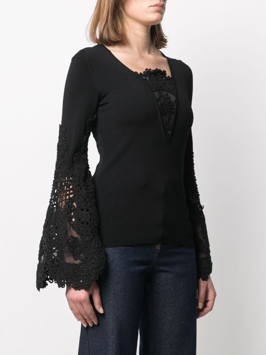 Chanel crochet sleeve jumper, a stylish knit top with intricate crochet sleeve details, featuring a classic Chanel design.