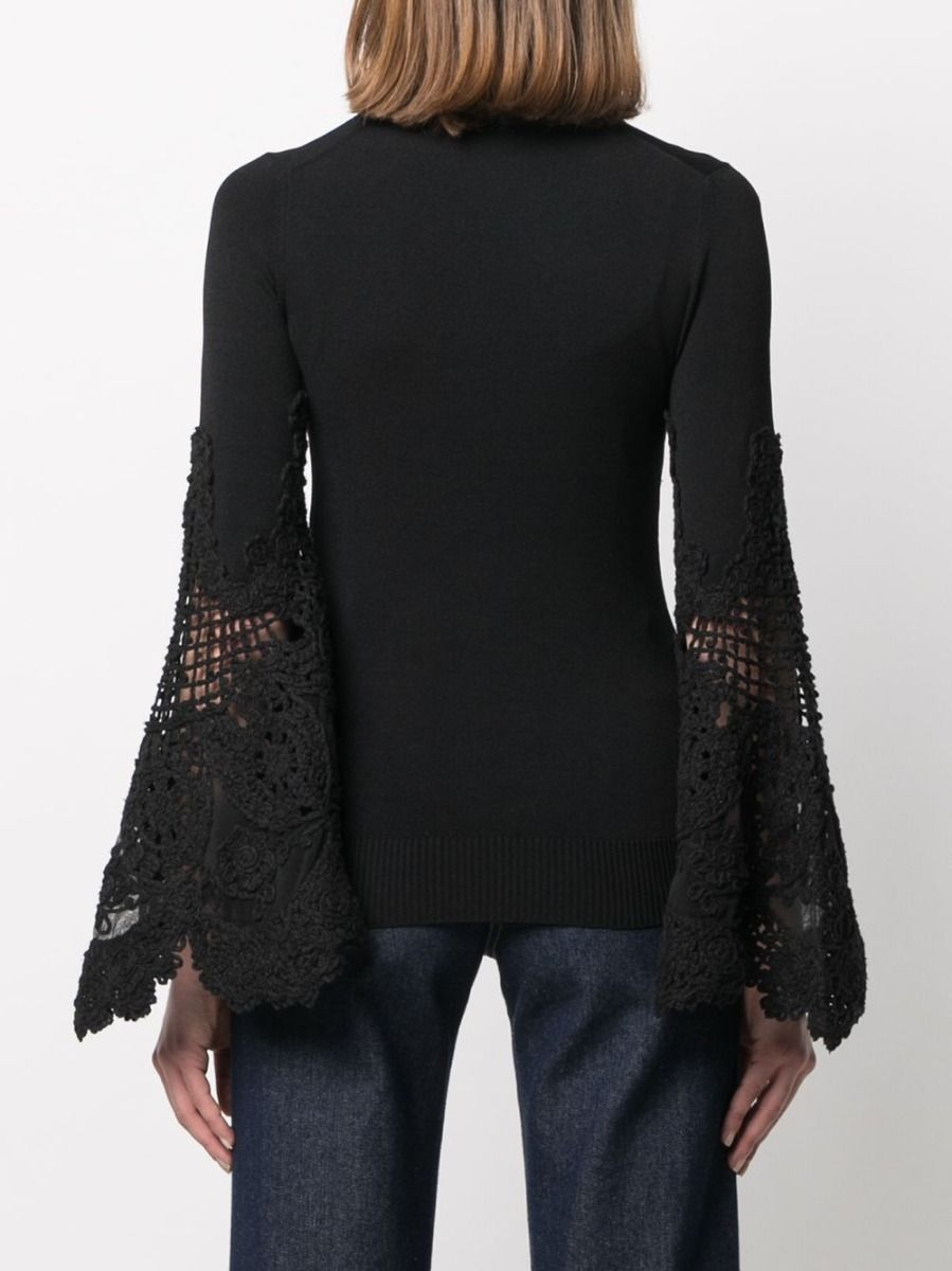 Chanel crochet sleeve jumper, stylish knit top with intricate crochet sleeves, in a cozy, fashionable design.