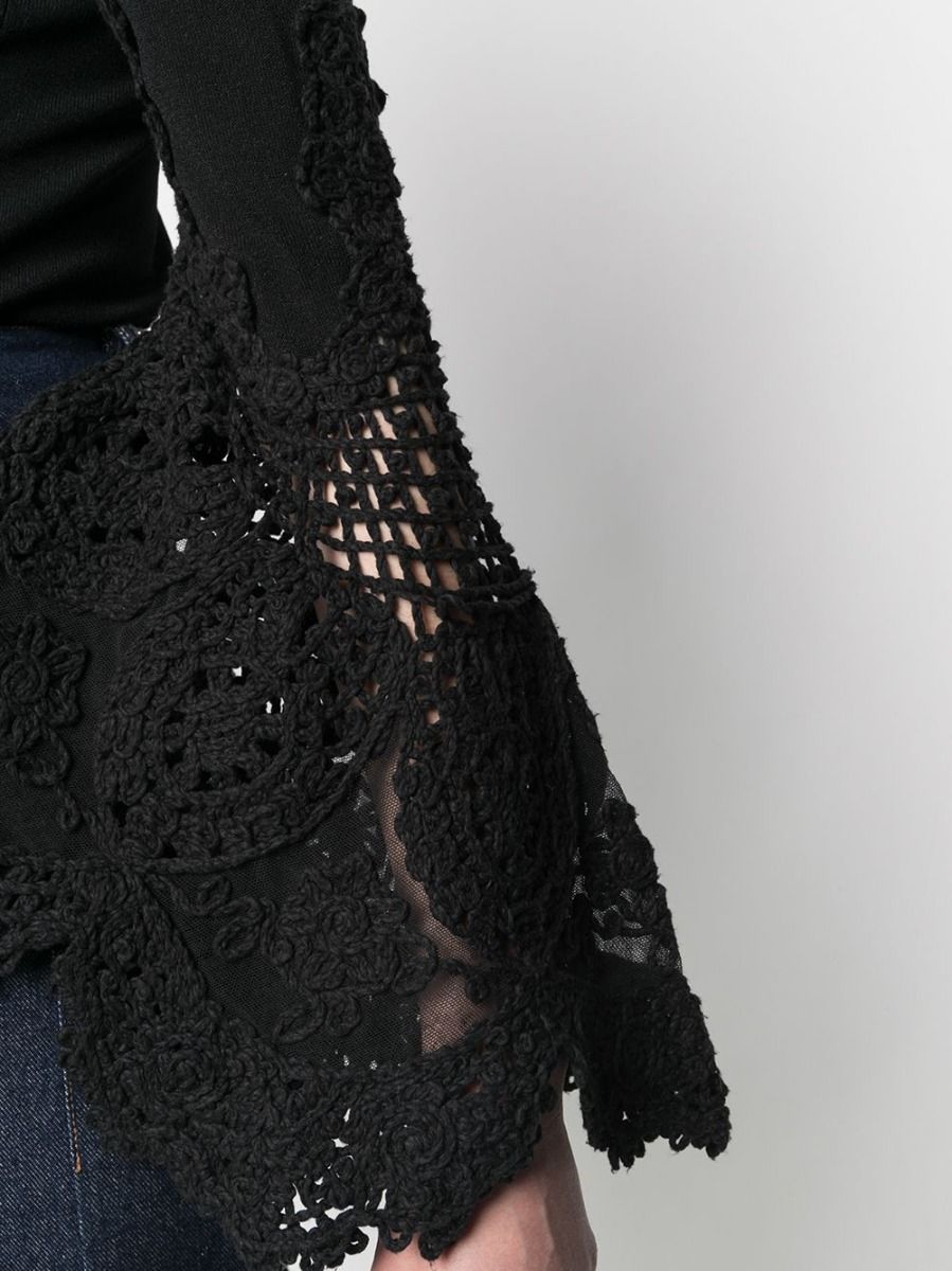 Chanel crochet sleeve jumper top featuring intricate knit design and stylish long sleeves, displayed on a neutral background.