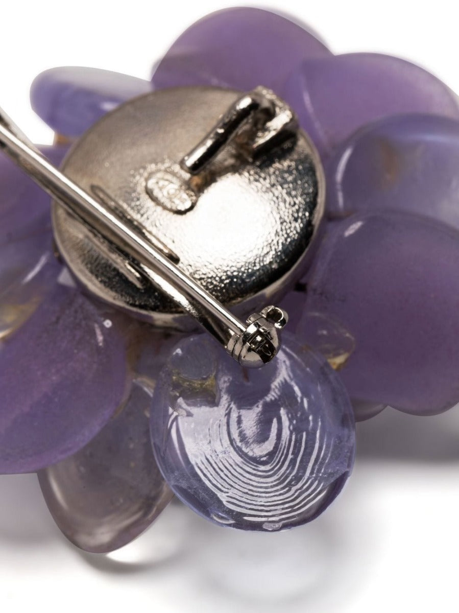 Chanel mauve glass and resin flower brooch with intricate petal details, elegant jewelry accessory featuring floral design.
