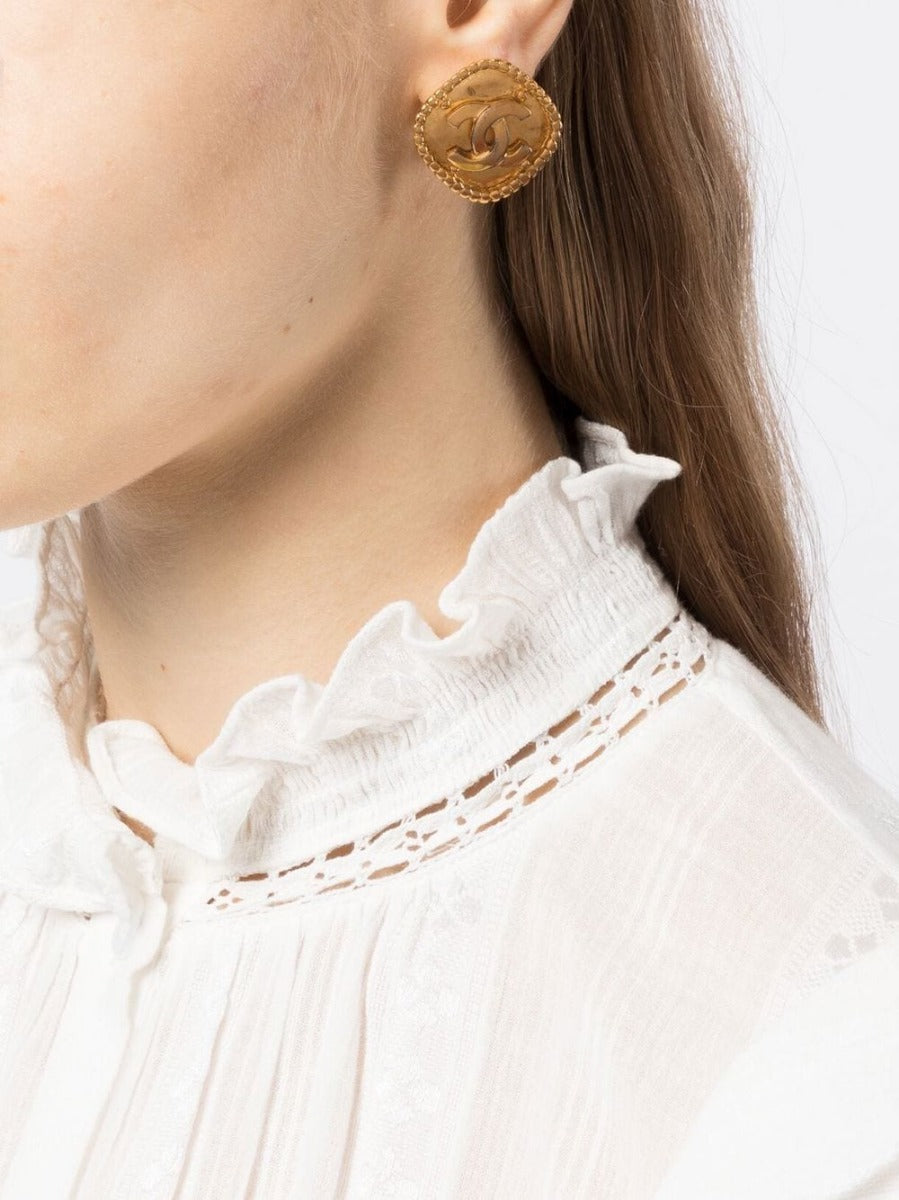 Gold-tone Chanel Rhombus clip-on earrings with geometric design, featuring sleek and stylish fashion accessory details.