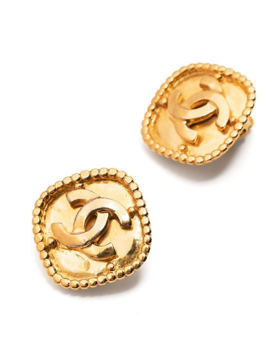 Gold-tone Chanel rhombus clip-on earrings with geometric design and logo detail, stylish and elegant accessory.