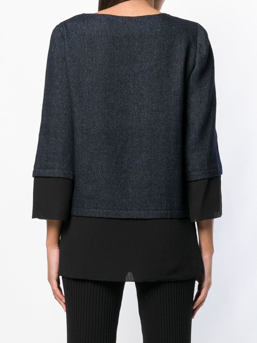 Chanel layered straight blouse for women, featuring a stylish design with multiple fabric layers, displayed on a hanger.