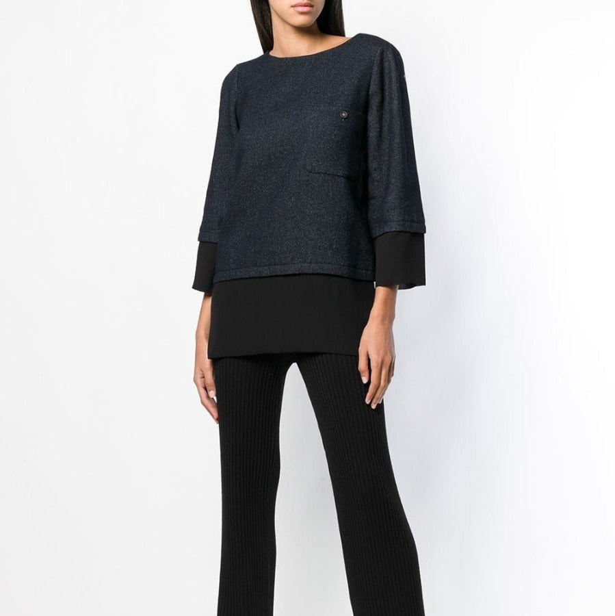 Chanel layered straight blouse, elegant tops with layered design and sleek fit, shown on a model.