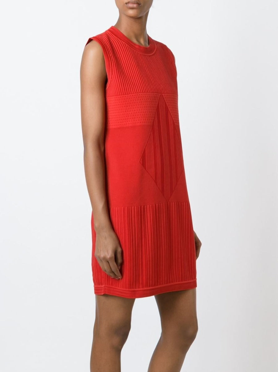 Chanel sleeveless red knit dress displayed on a mannequin, showcasing a stylish and elegant sleeveless design with a fitted silhouette.