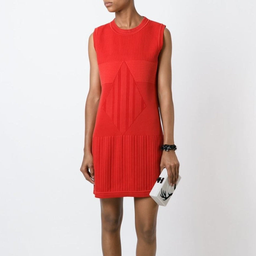 Chanel sleeveless red knit dress displayed on a mannequin, showcasing a stylish and vibrant sleeveless dress design.