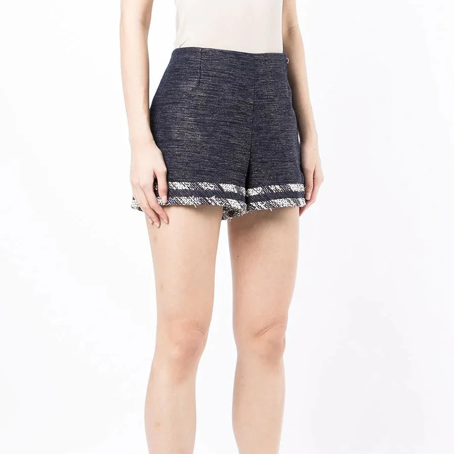 Blue striped tweed shorts by Chanel featuring a tailored fit and classic design, perfect for stylish casual wear.