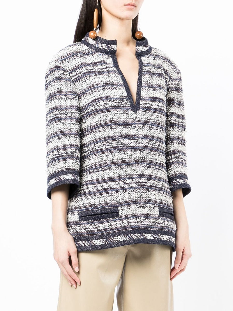 Blue and white striped Chanel tweed tunic top with a classic, textured design and tailored fit.