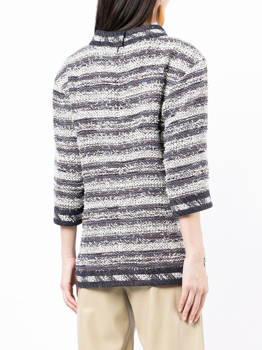 Blue and white striped tweed Chanel tunic top with long sleeves and classic design, shown on a model.