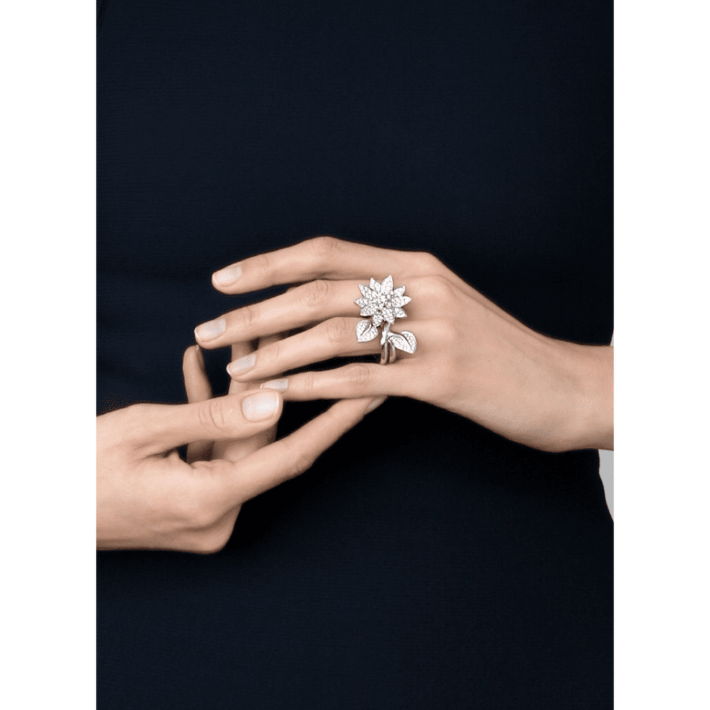 Van Cleef & Arpels diamond Lotus Between the Finger Ring with intricate floral design and sparkling diamonds.