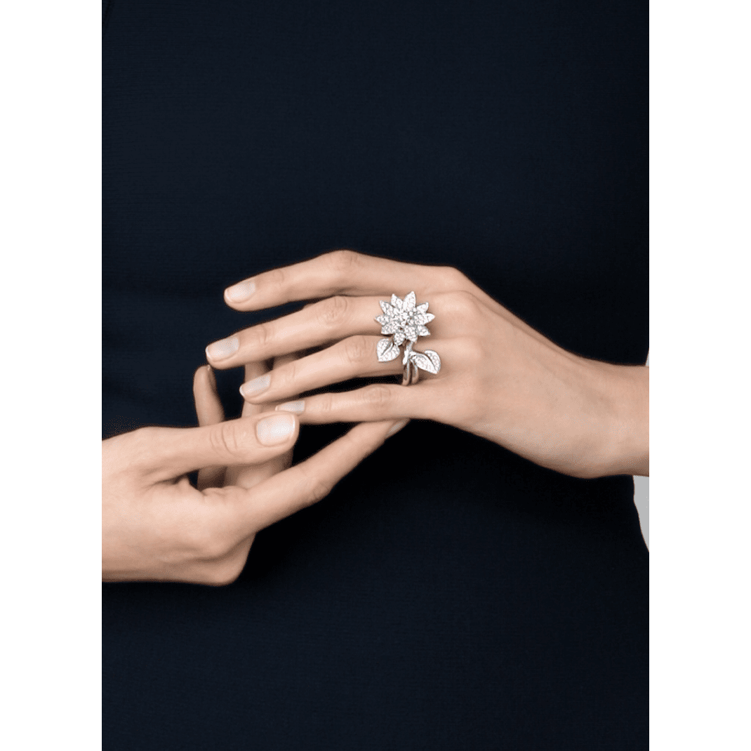 Van Cleef & Arpels diamond Lotus Between the Finger Ring with intricate floral design and sparkling diamonds.