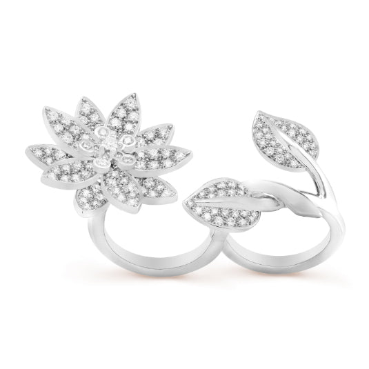 Van Cleef & Arpels diamond lotus between the finger ring with detailed floral design and sparkling diamond accents.