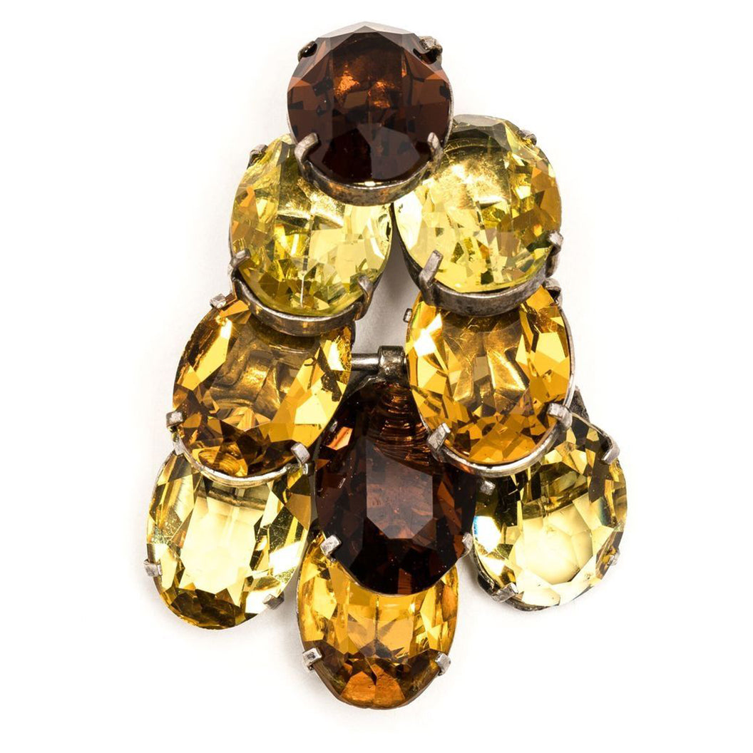 Dior crystal-embellished brooch with sparkling clear crystals on a silver-tone metal base, showcasing elegant jewelry design