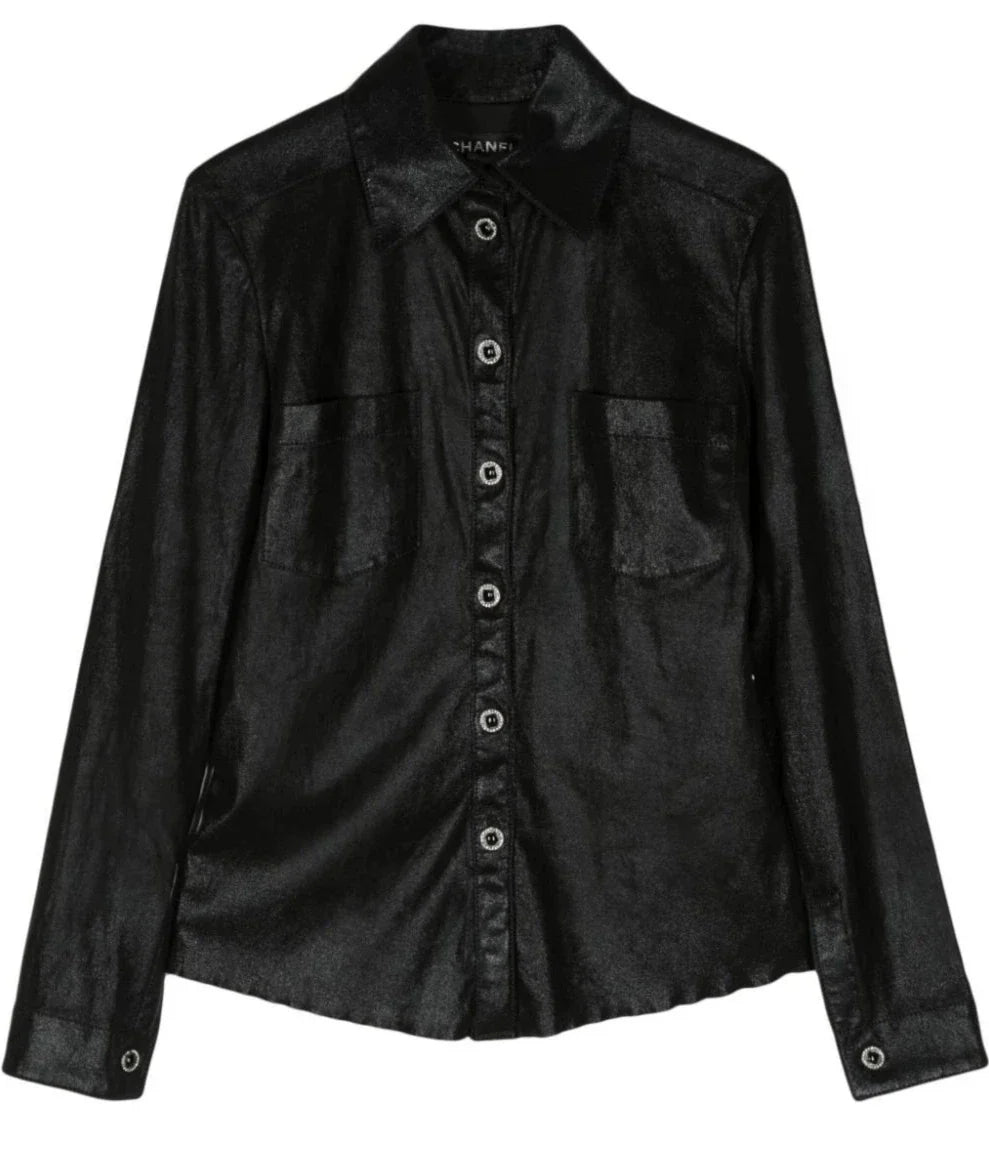 Black elasticated Chanel top with fitted design and long sleeves, showcasing a sleek, modern style.