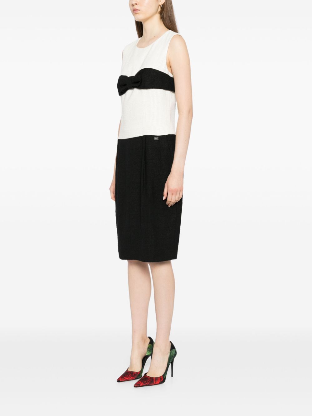 Color-block dress by Rewind Vintage Affairs featuring bold geometric patterns and a fitted silhouette, perfect for stylish occasions.