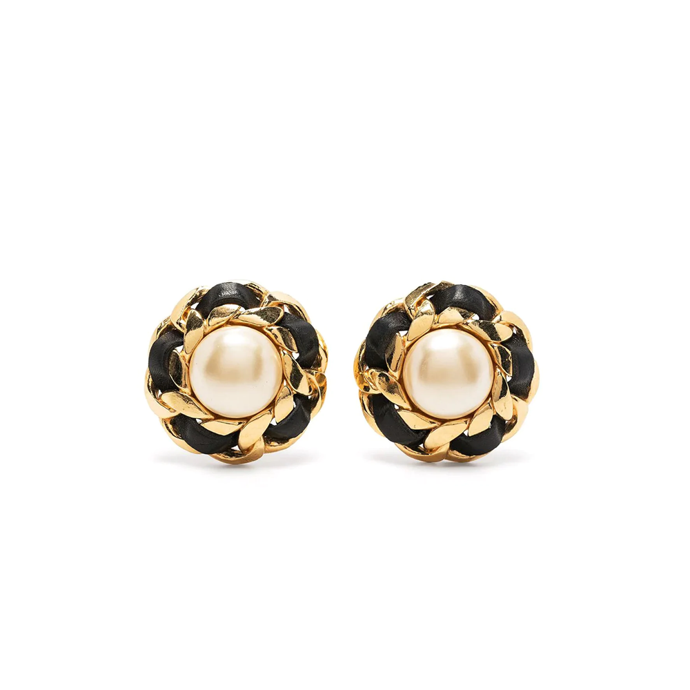 Chanel 1970s pearl button earrings featuring classic round pearls and gold-tone settings on a clean background.