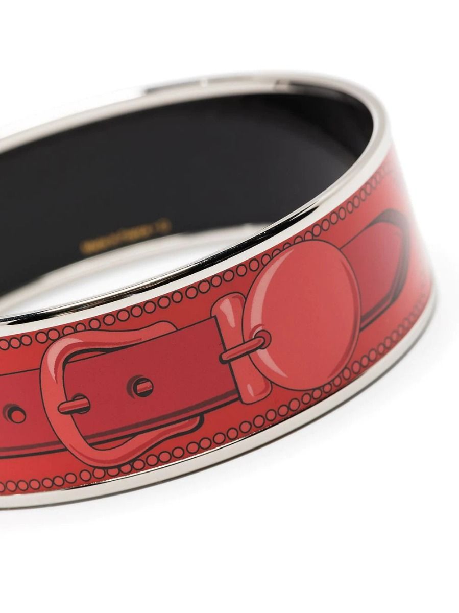 Hermès belt pattern bracelet showcasing woven leather design and silver clasp, stylish accessory for wrists
