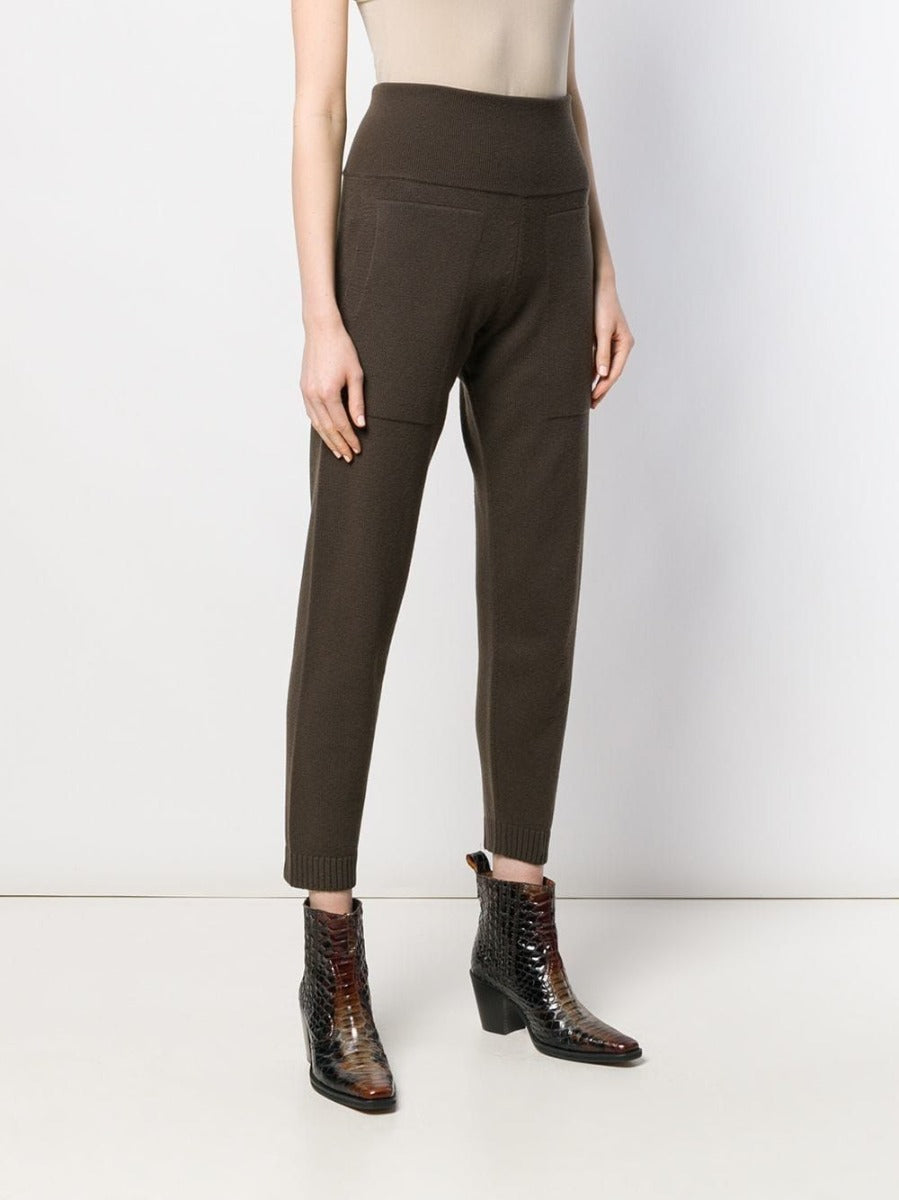 Hermès brown knitted lounge trousers shown on a model, featuring a relaxed fit and comfortable knit fabric for casual wear.