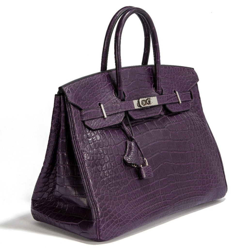 Hermès Birkin 35 crocodile leather top handle bag in rich amethyst purple with gold hardware.
