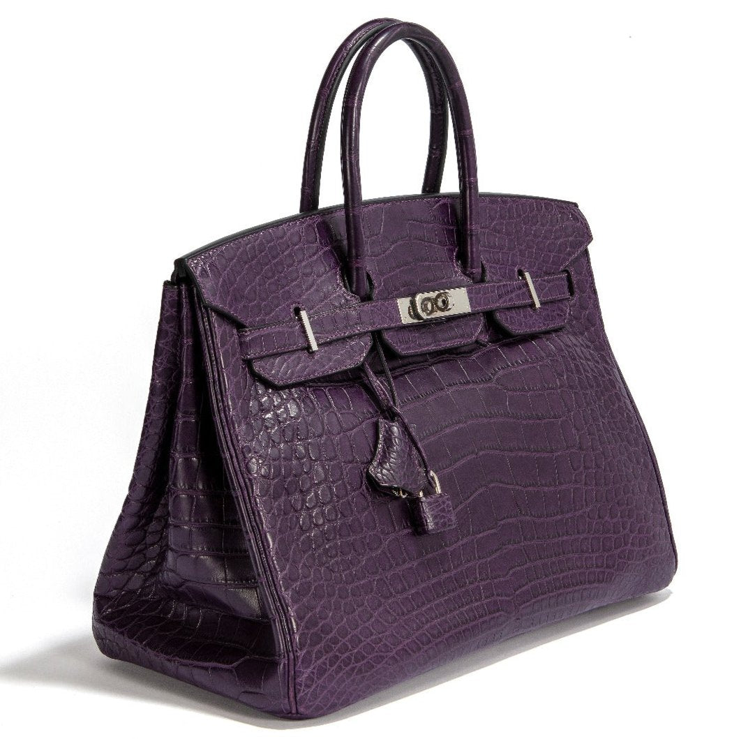 Hermès Birkin 35 crocodile leather top handle bag in rich amethyst purple with gold hardware.