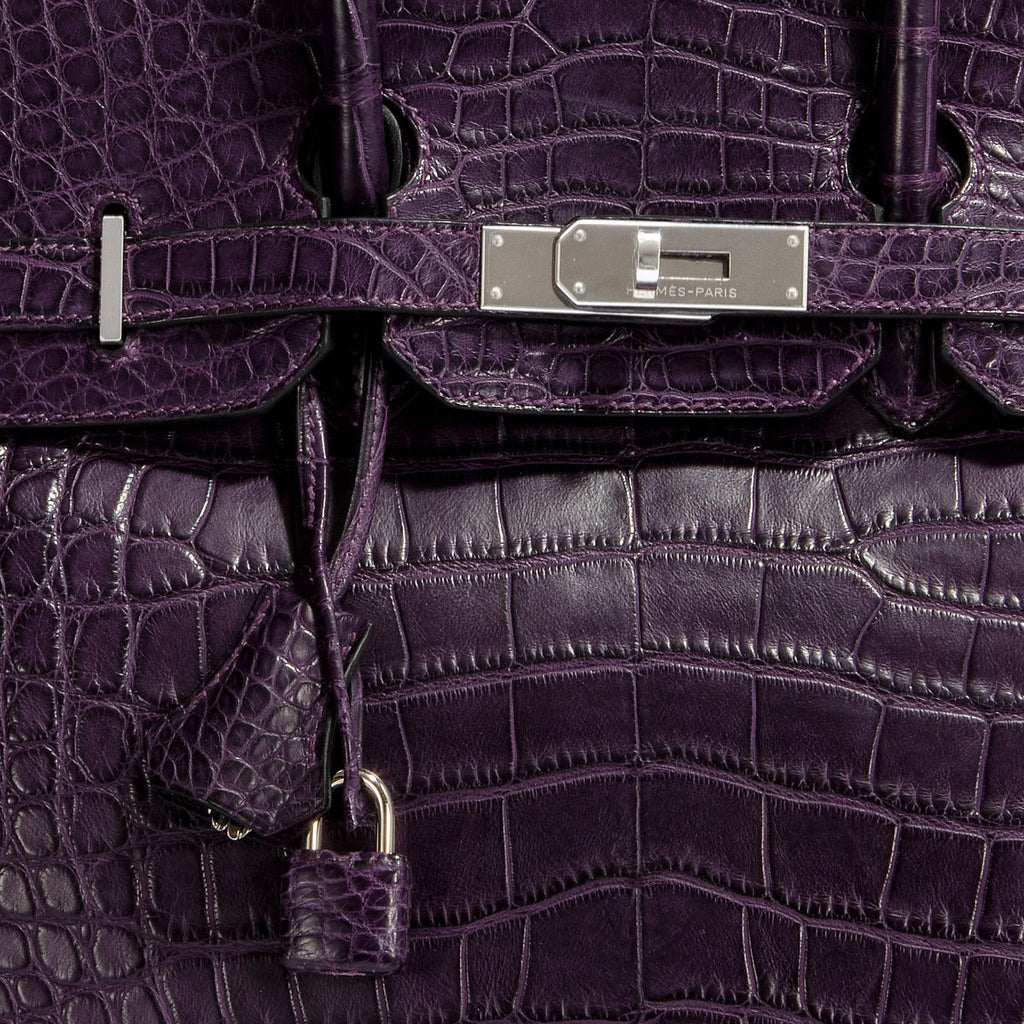 Hermès Birkin 35 Amethyst purple crocodile leather top handle bag with gold hardware, showcasing luxurious textured finish.