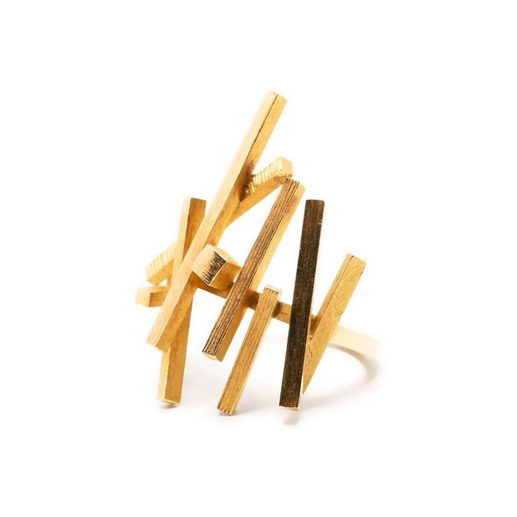 Vintage Finds 1970's overlapping rods ring featuring layered metal bands and a retro design, close-up view of the jewelry piece.
