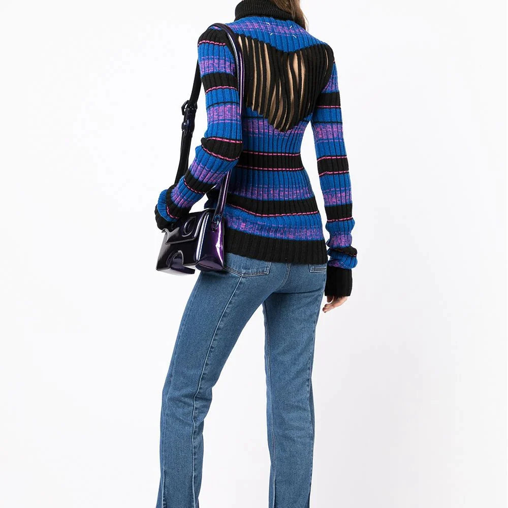 Striped turtleneck ribbed knit jumper by Maison Martin Margiela, showcasing the textured fabric and bold stripe pattern.