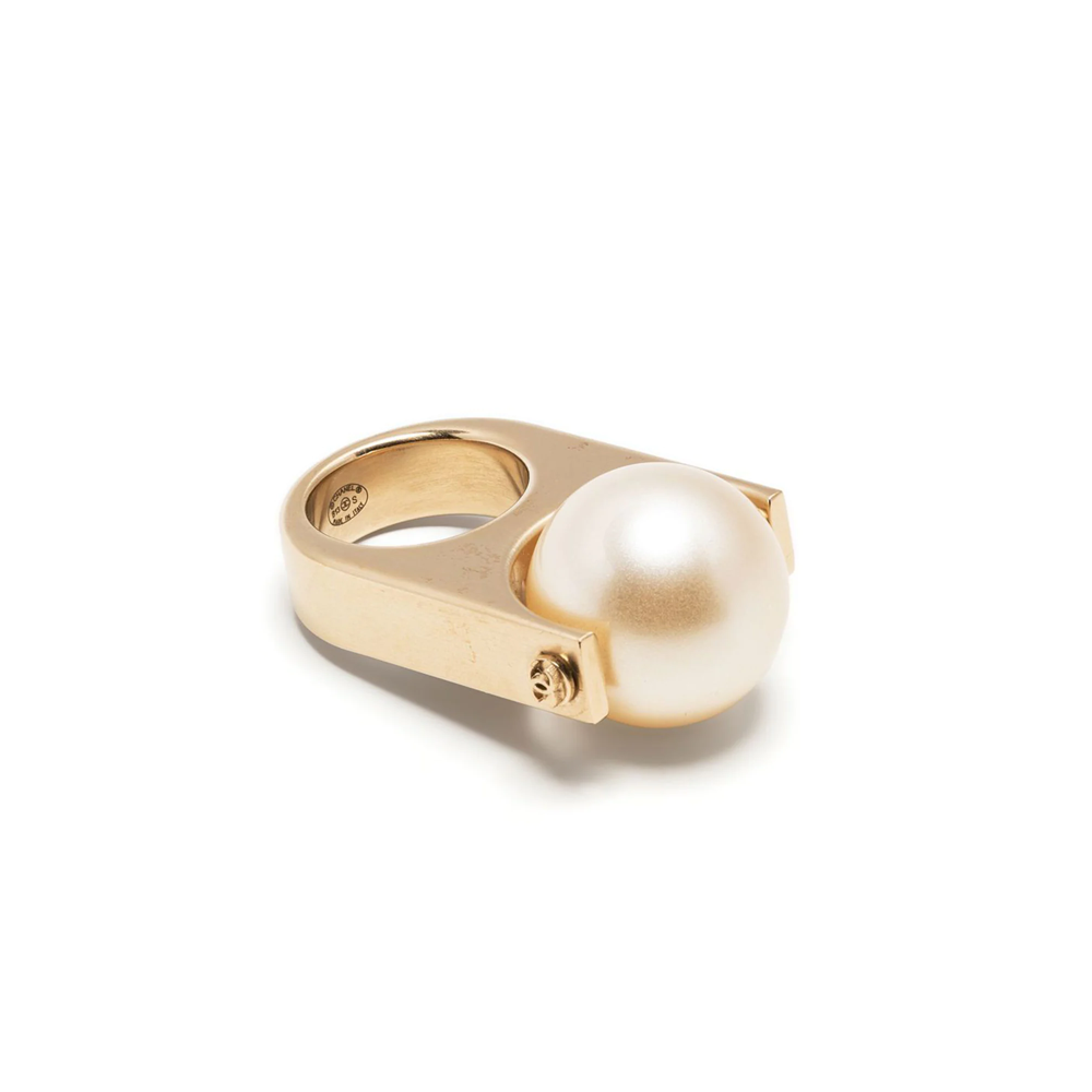 Chanel CC pearl-embellished ring with silver band and elegant pearl accents, showcasing luxury jewelry design.