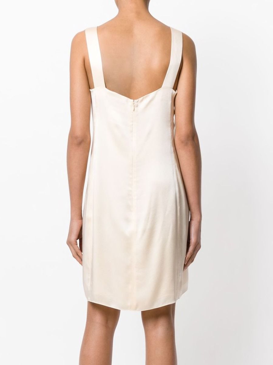 Vintage Chanel peach silk-satin dress featuring elegant detailing and classic style, perfect for sophisticated occasions.